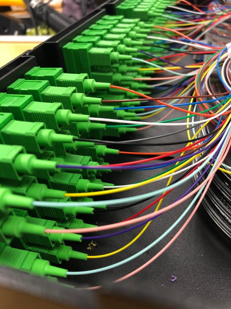 Close-up of Tekify fiber-optic connectors and pigtails